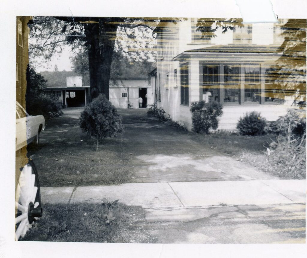 unknown location FIC A Enclosed Front Porch Barn in Back Wooden Wheel